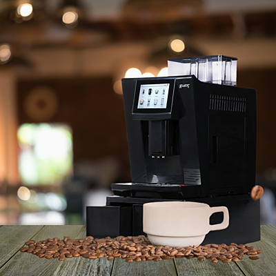 The Atlantis Brew coffee machine with a carafe of milk attached for making lattes and cappuccinos.