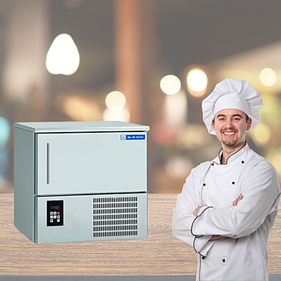Chef placing food trays into a Blue Star BF03G Blast Freezer.