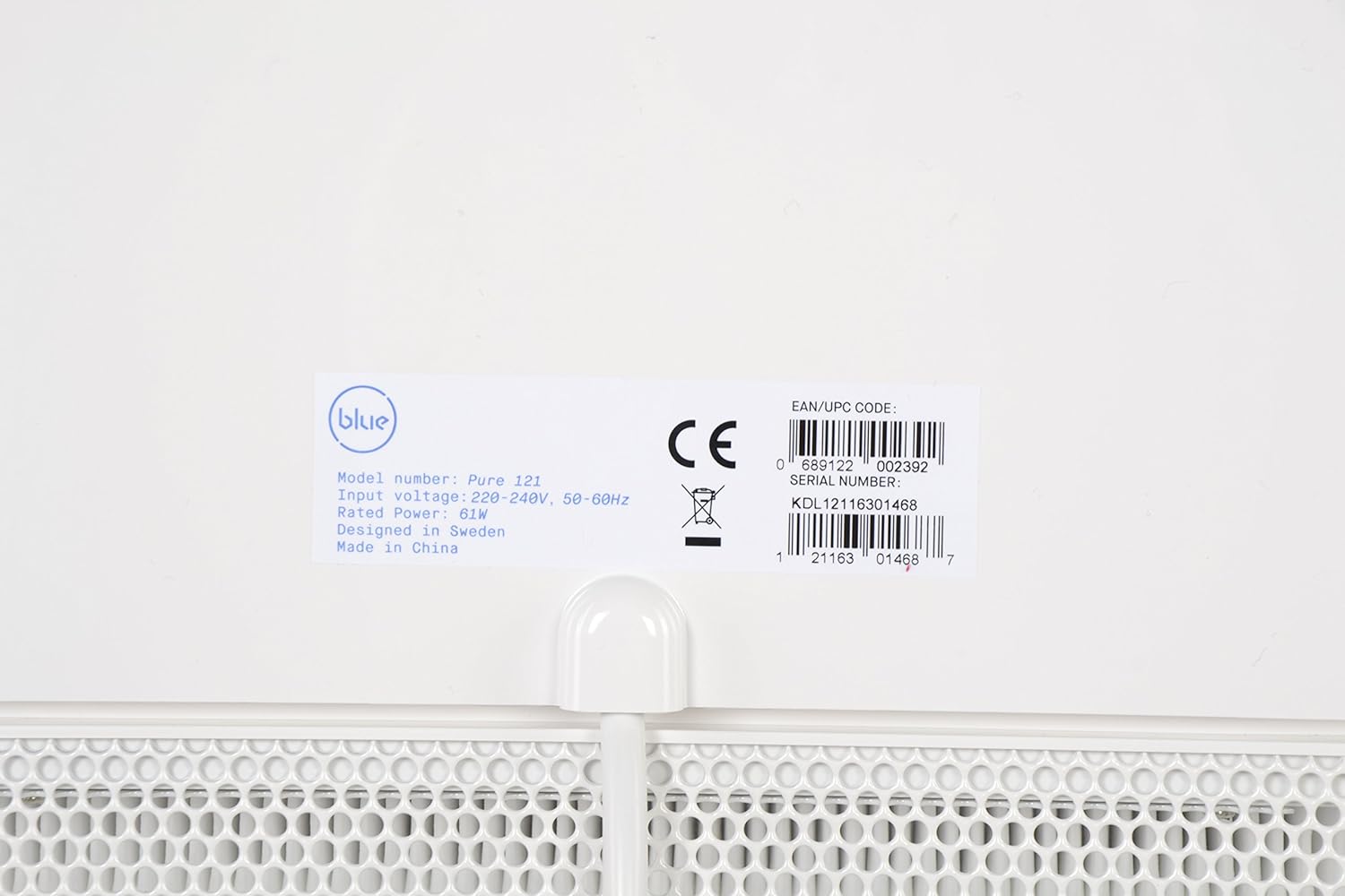 The compact and powerful Blueair Bedroom Air Purifier placed next to a bed.