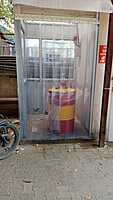 Buzz Lite PVC Strip Curtain effectively preventing dust and debris from entering a workspace Buzz Lite PVC Strip Curtain effectively preventing dust and debris from entering a workspace