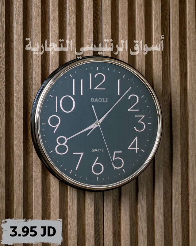 ساعة حائظ سوداء دائرية