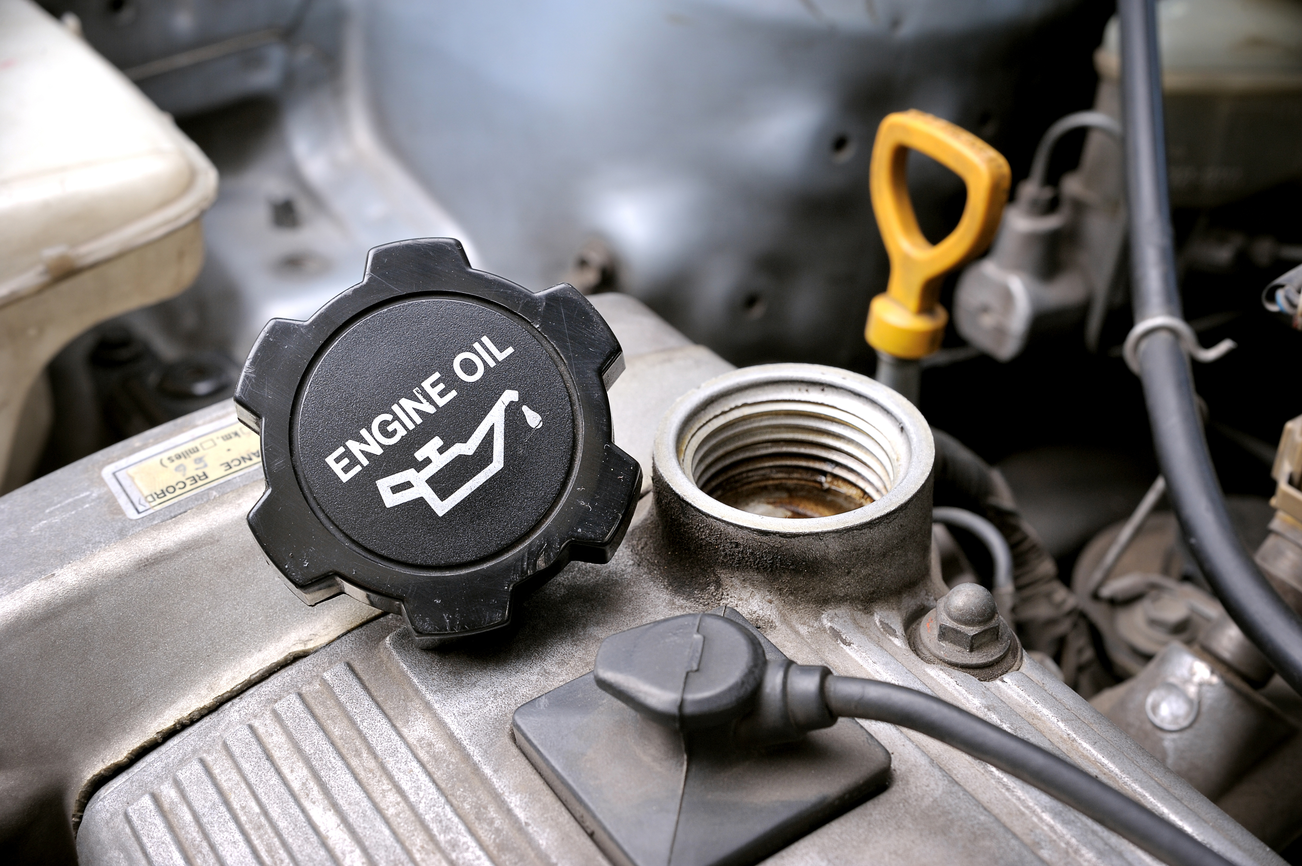 image showing oil fill cap is off when adding oil image showing oil fill cap is off when adding oil