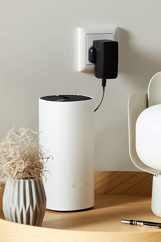 TP‑LINK Deco M4 placed on a home shelf, boosting internet signal 200 mesh Wi‑Fi. TP‑LINK Deco M4 placed on a home shelf, boosting internet signal 200 mesh Wi‑Fi.